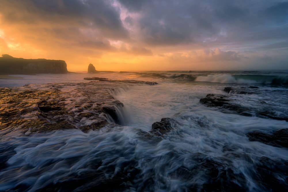 Golden Hour Coastal Waves by Johnny Zhang — canvas wall art