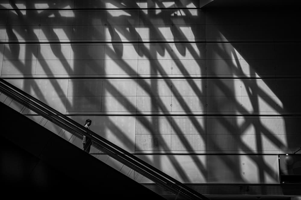 Geometric Escalator Shadows by Yohei Kawashima — canvas wall art