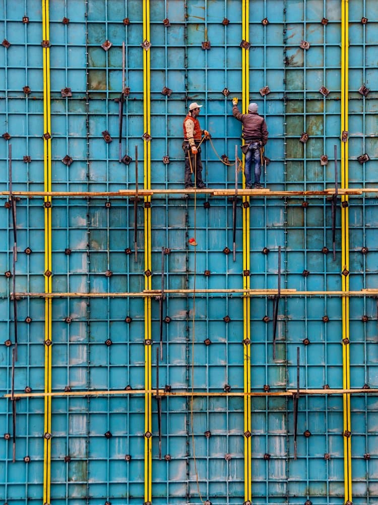 Workers on Blue Grid by Emir Bagci — canvas wall art