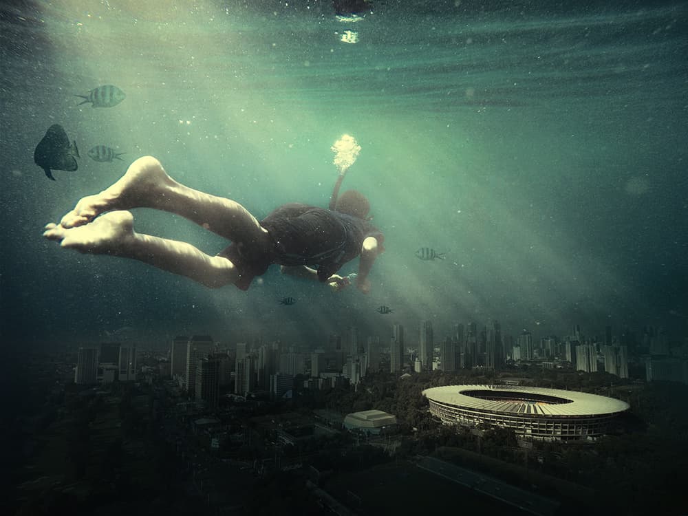 Swimmer Over Submerged City by Hari Sulistiawan — canvas wall art