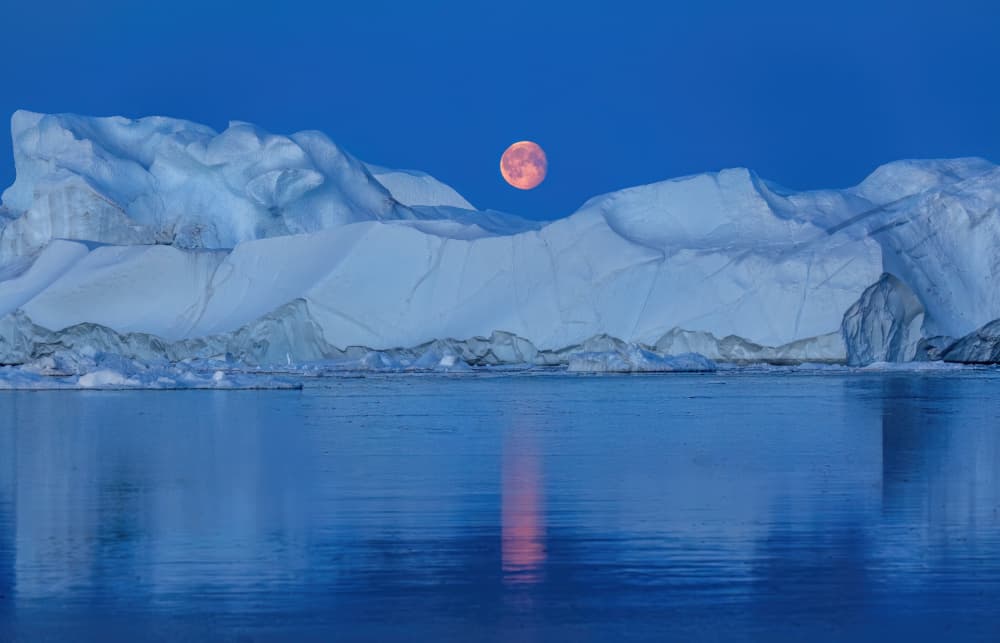 Red Moon Over Icebergs by Jie Jin — canvas wall art