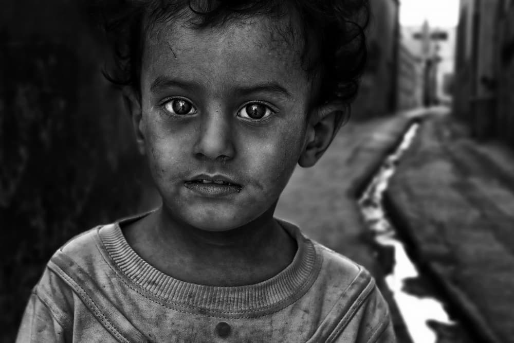 Pensive Street Child by Foad Mirzaie — canvas wall art