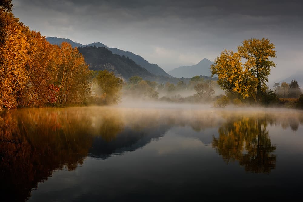 Misty Autumn Lake Reflections by Roberto Marini — canvas wall art