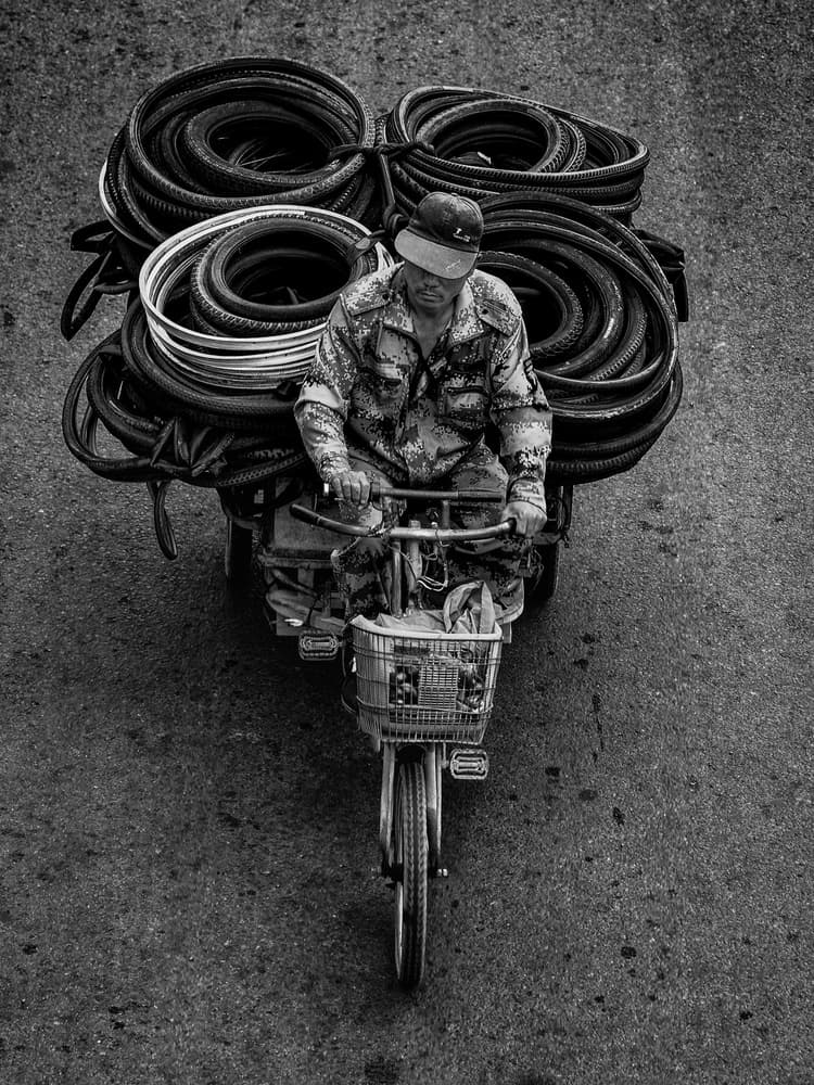 Urban Tire Cyclist by Anchor Lee — canvas wall art