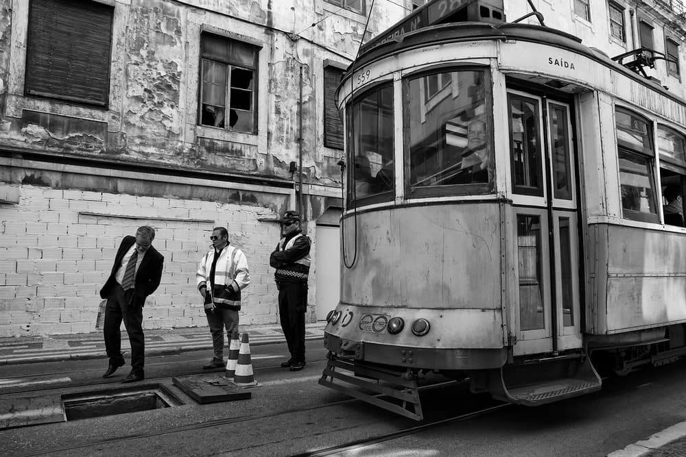 Old City Tram And Men by Luis Sarmento — canvas wall art