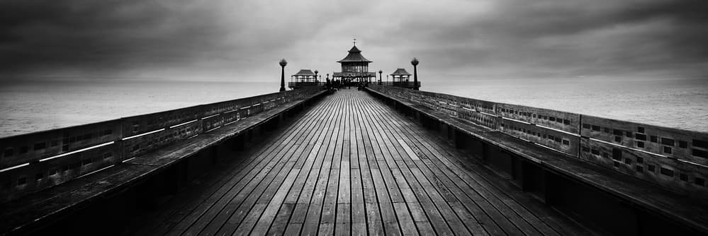 Moody Pier Horizon by Catalin Alexandru — canvas wall art