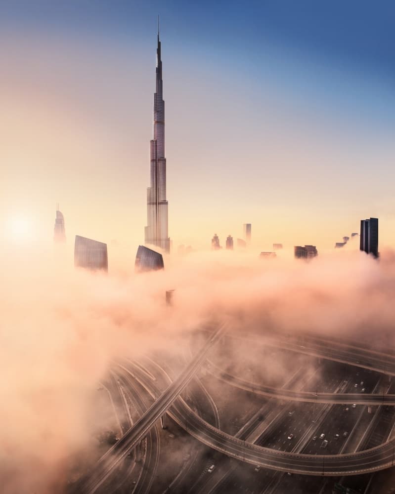 Towering City Sunrise by Esmée Prexus — canvas wall art