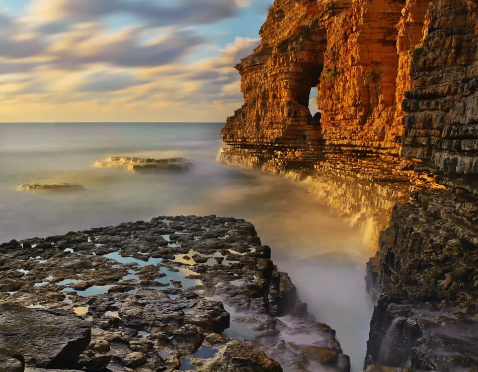 Golden Cliffs Sea Arch by Ibrahim Canakci — canvas wall art
