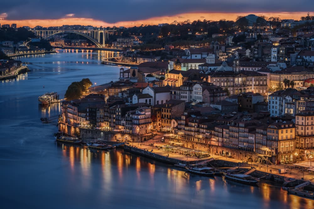 Porto Riverside Evening Glow by Nicholas — canvas wall art