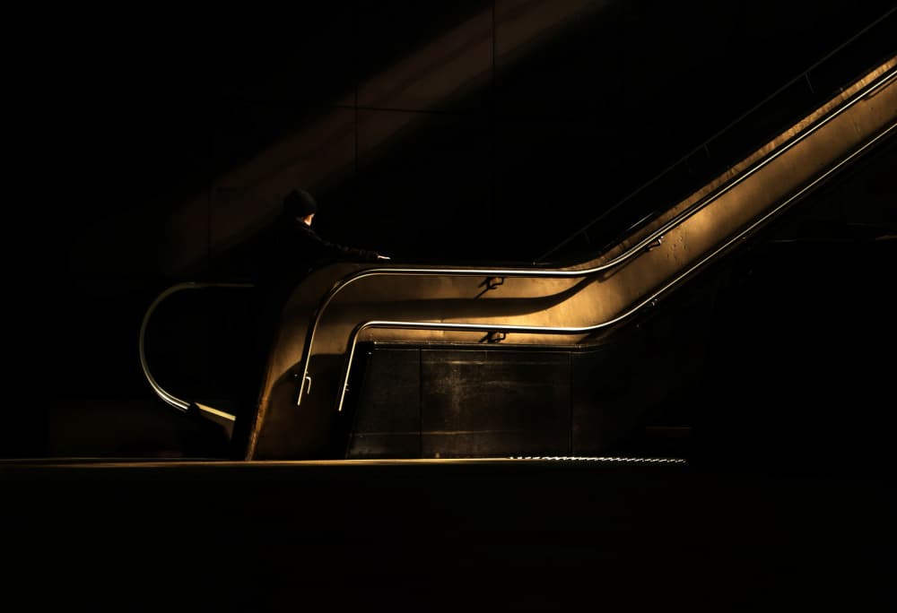 Solitary Escalator Ride by Anna Niemiec — canvas wall art