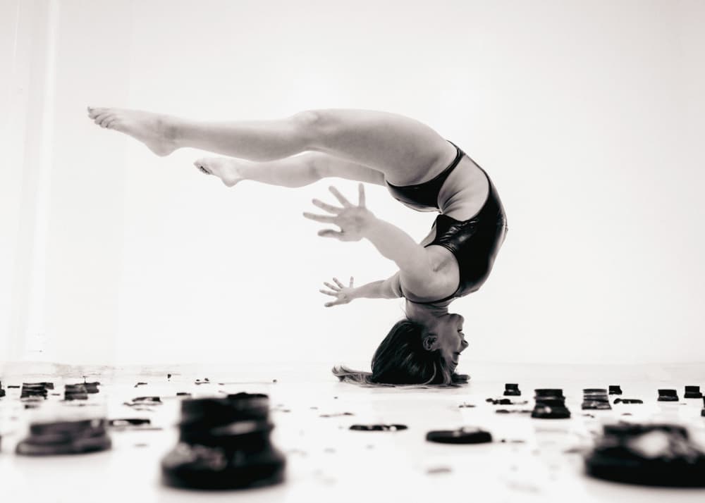 Dynamic Headstand Pose by Tyler McAuley — canvas wall art