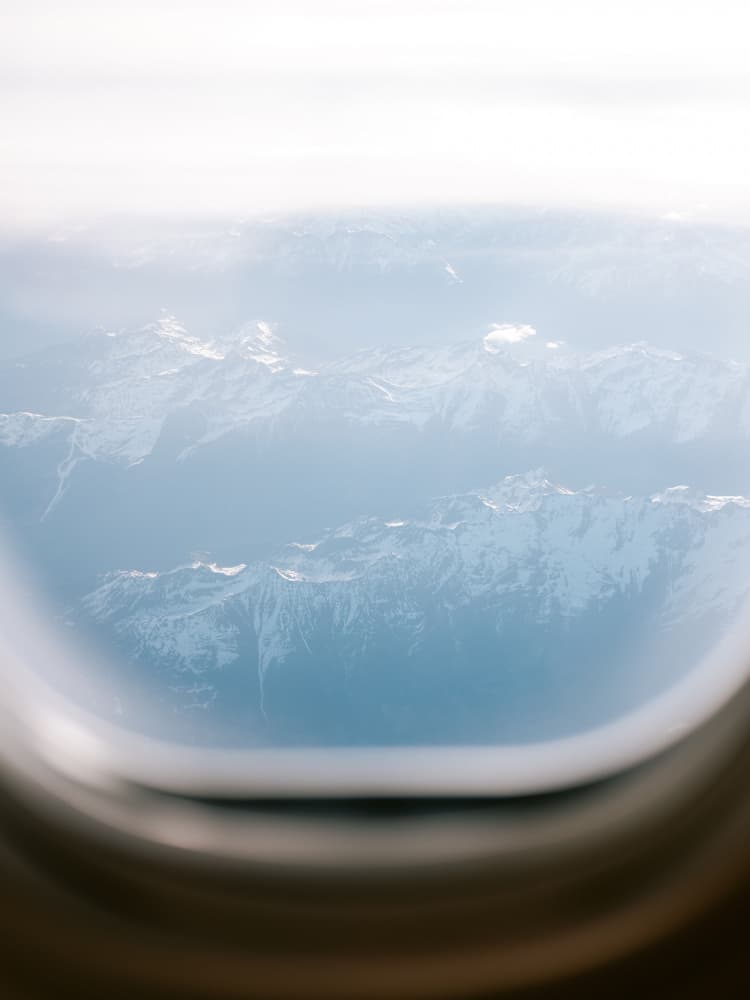 Plane Window View by Raisa Zwart — canvas wall art