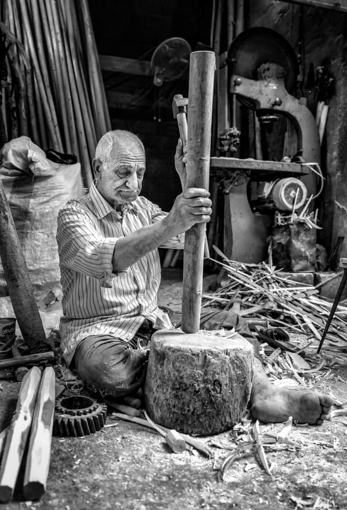 Master Woodworker At Work by Bashar Alsofey — canvas wall art