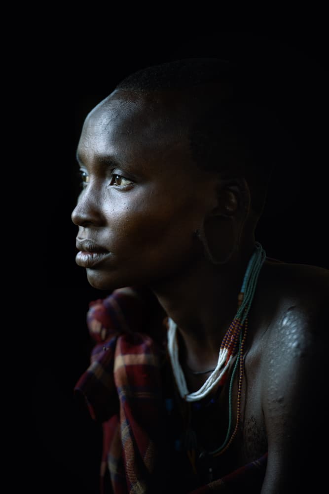 Pensive African Woman Profile by Trevor Cole — canvas wall art