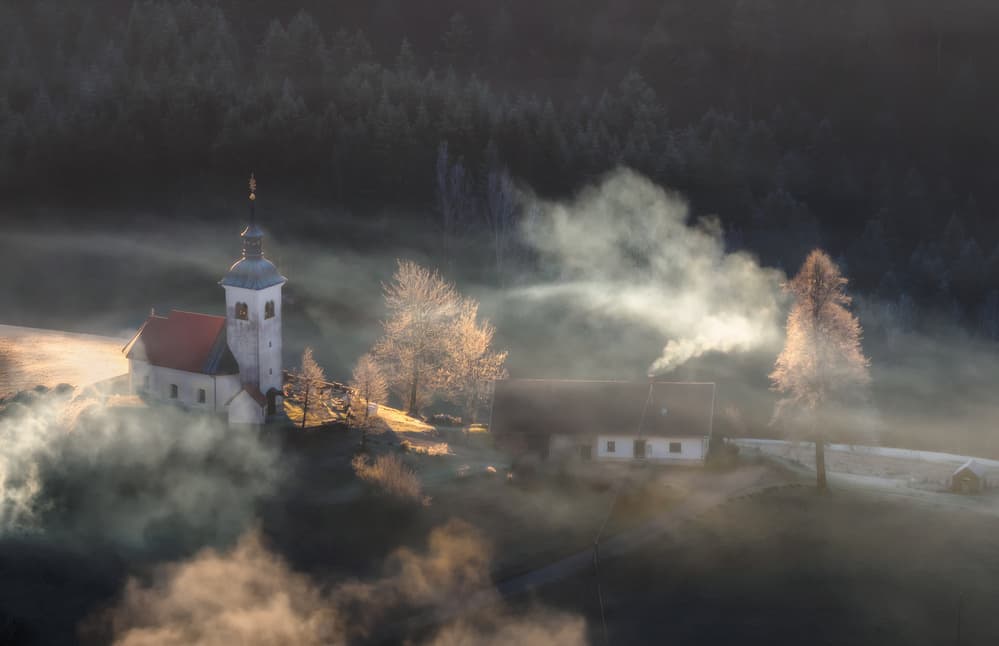 Golden Morning Fog Village by Ales Komovec — canvas wall art