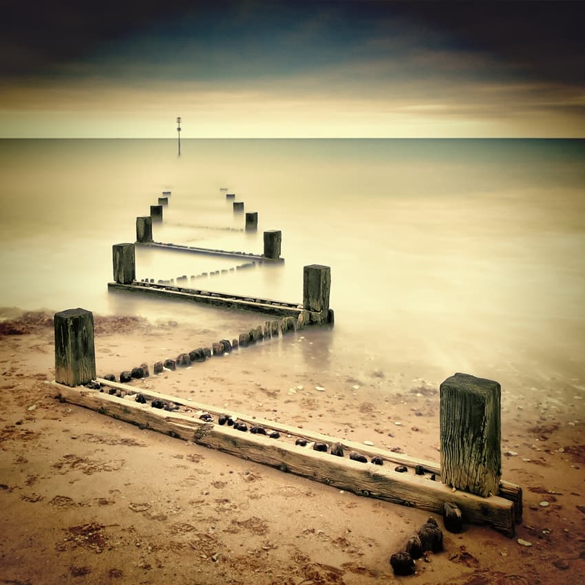 Misty Ocean Groynes by Michael Oates — canvas wall art