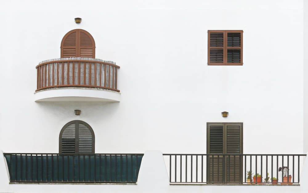 White Facade Balconies by Hans Peter Rank — canvas wall art
