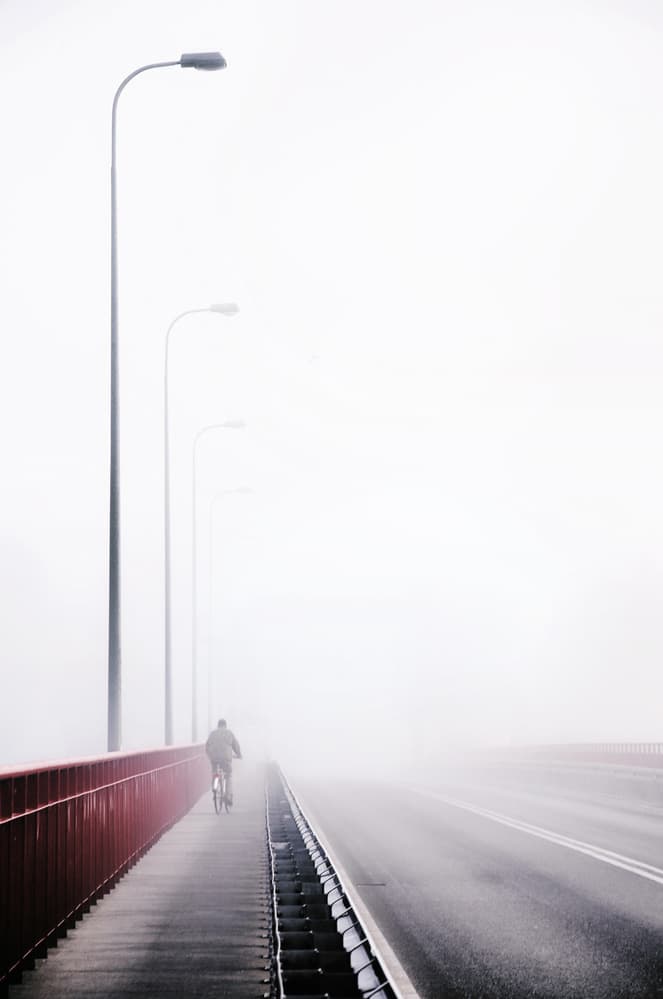 Foggy Bridge Cyclist by Anna Niemiec — canvas wall art