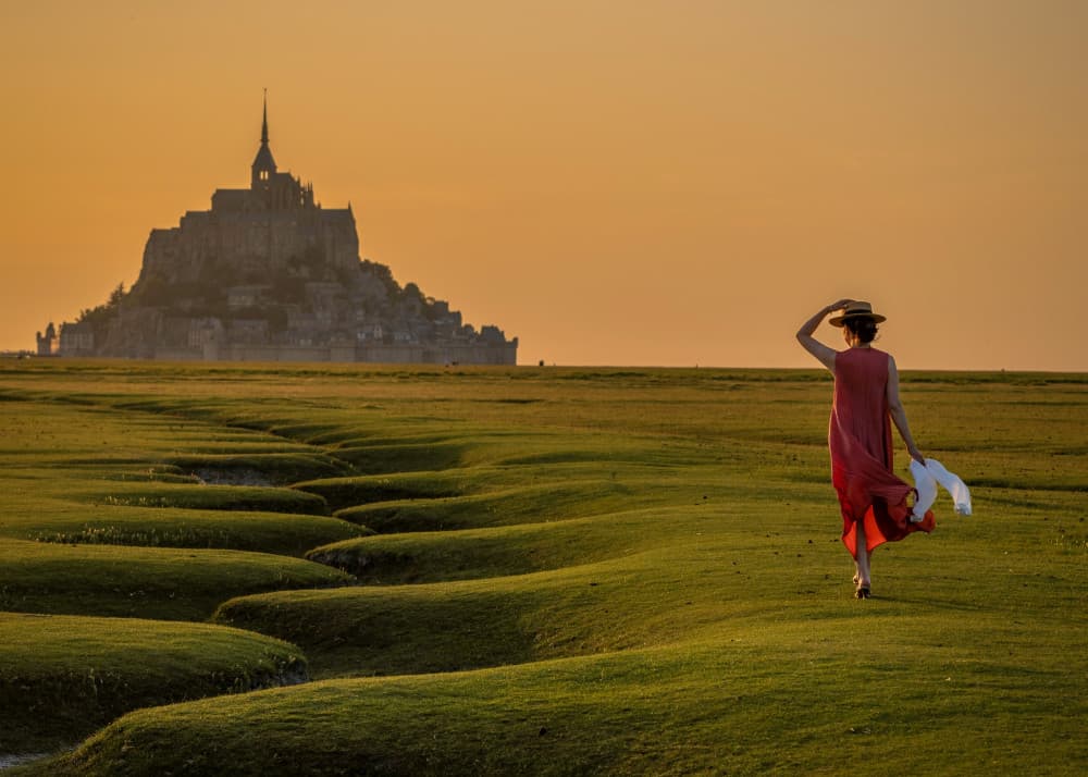 Woman at Golden Mont Saint-Michel by Liz Fang — canvas wall art