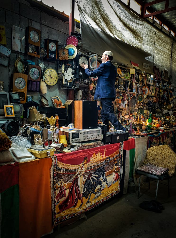 Vintage Clock Seller by Bashar Alsofey — canvas wall art
