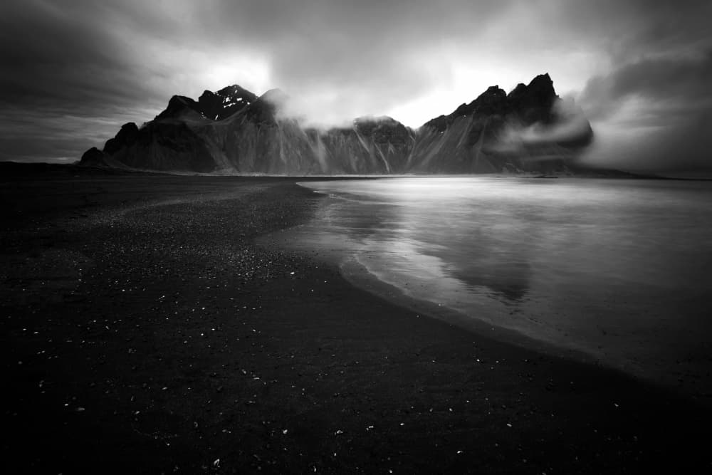Dramatic Black Beach Mountains by Erik Engström — canvas wall art