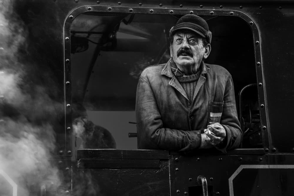 Thoughtful Train Driver by Irene Perovich — canvas wall art