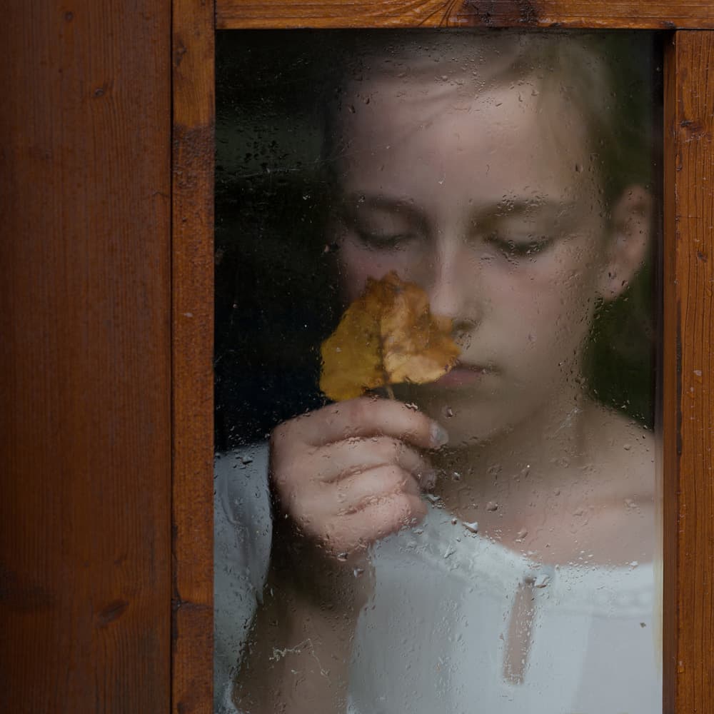 Pensive Girl Rainy Window by Mirjam Delrue — canvas wall art