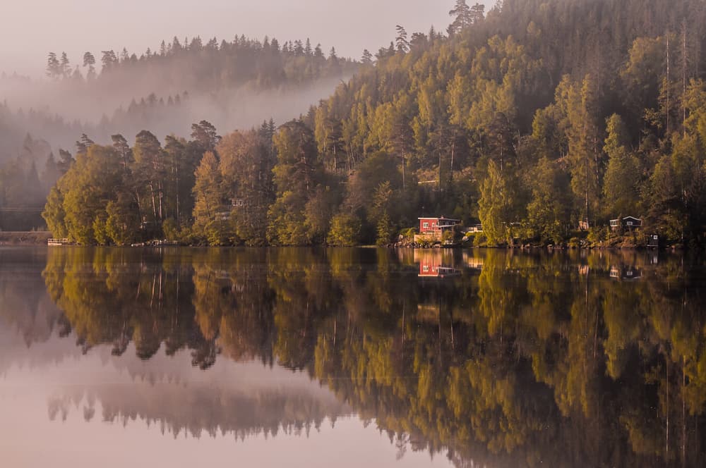 Misty Lake Cabin Reflection by Benny Pettersson — canvas wall art