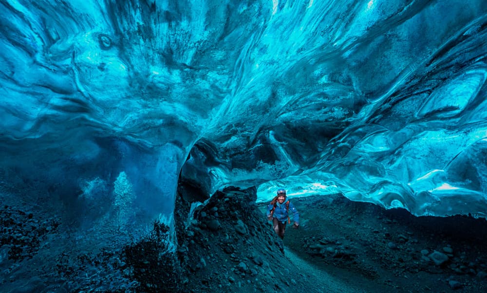 Blue Ice Cave Explorer by Lydia Jacobs — canvas wall art