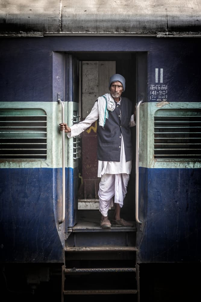 Indian Man Train Journey by Pavol Stranak — canvas wall art