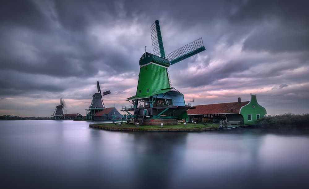 Green Windmills Calm Waters by Jesús M. García — canvas wall art