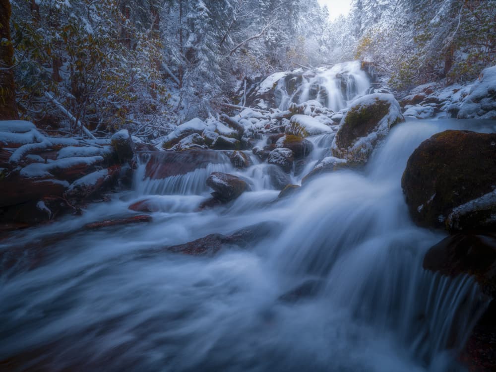 Snowy Winter Waterfall by Yezimao — canvas wall art