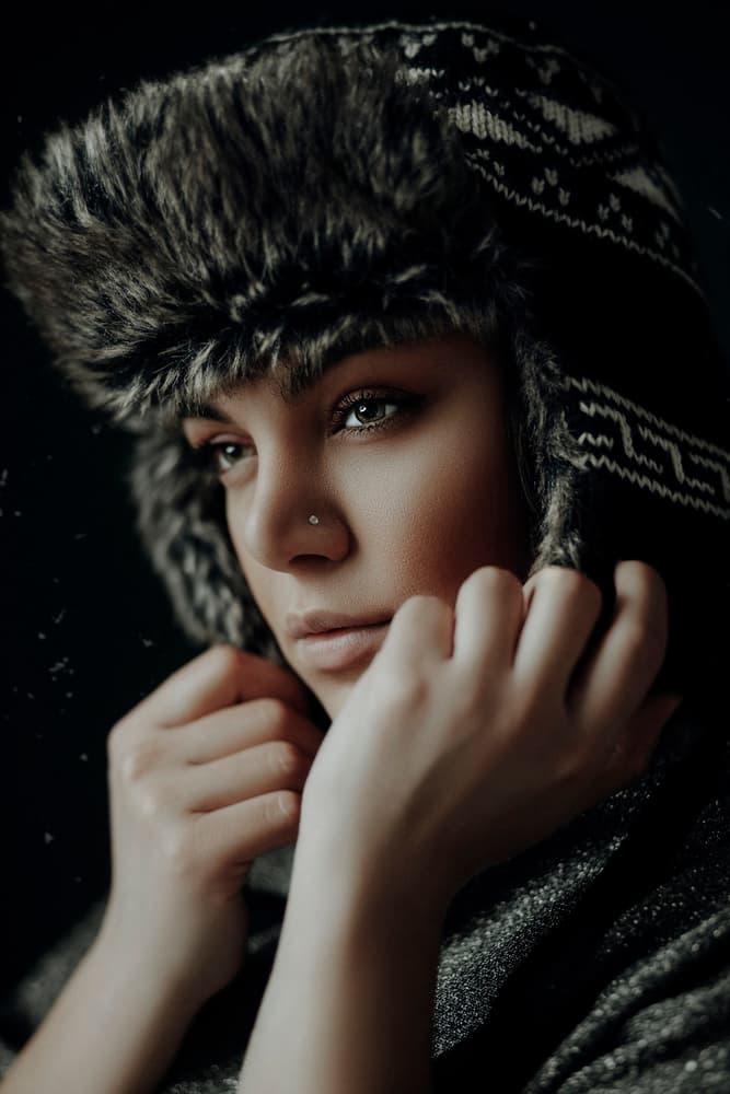 Pensive Woman Fur Hat by Amin Hamidnezhad — canvas wall art
