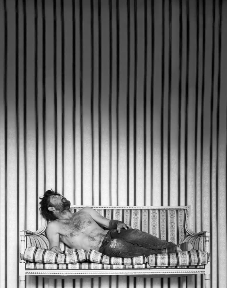 Pensive Man on Couch by Davide Barzaghi — canvas wall art