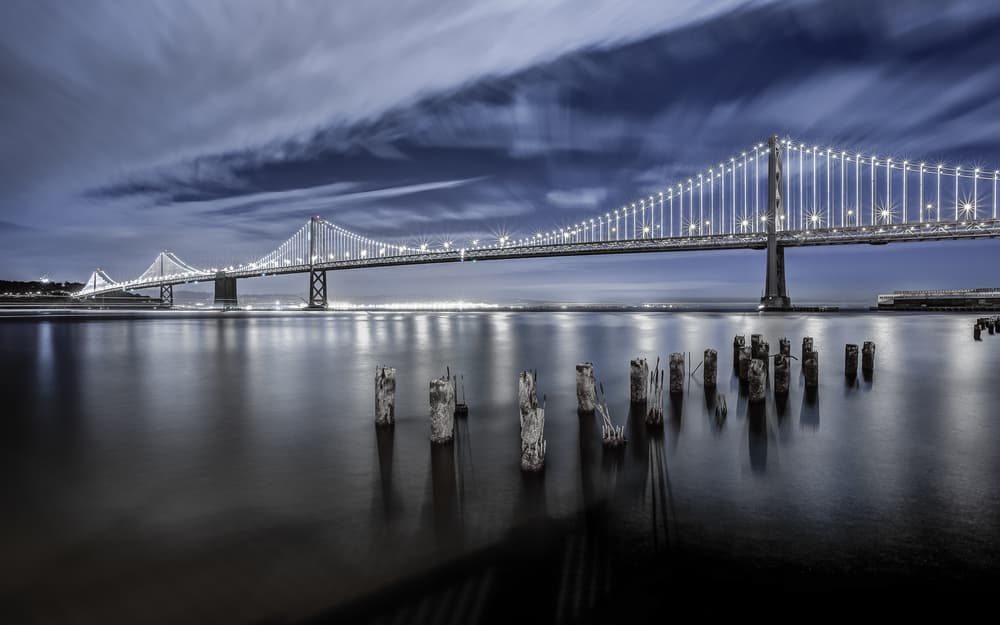 Night Bridge City Lights by Toby Harriman — canvas wall art