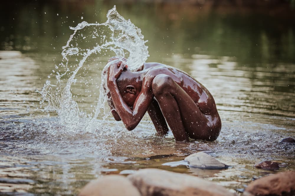 Boy Splashing Water by Vedran Vidak — canvas wall art