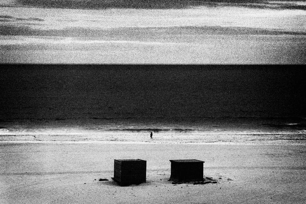 Lone Figure Vast Beach by Paulo Abrantes — canvas wall art