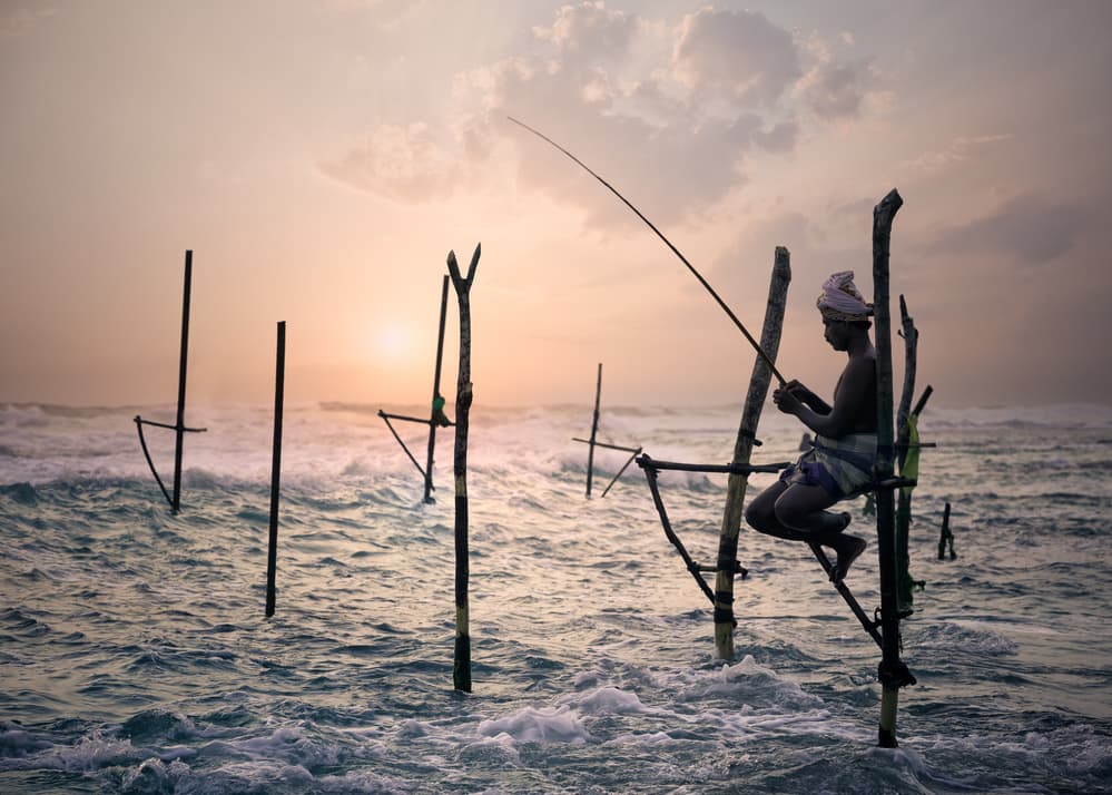 Stilt Fisherman Sunset by Aleksander Poniewierski — canvas wall art