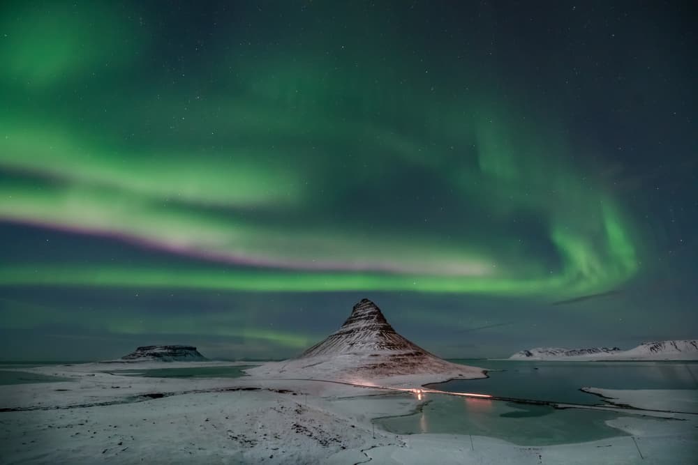 Northern Lights Winter Peak by April Xie — canvas wall art