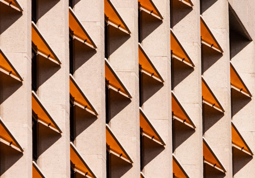 Sunlit Architectural Triangles by Jacqueline Hammer — canvas wall art