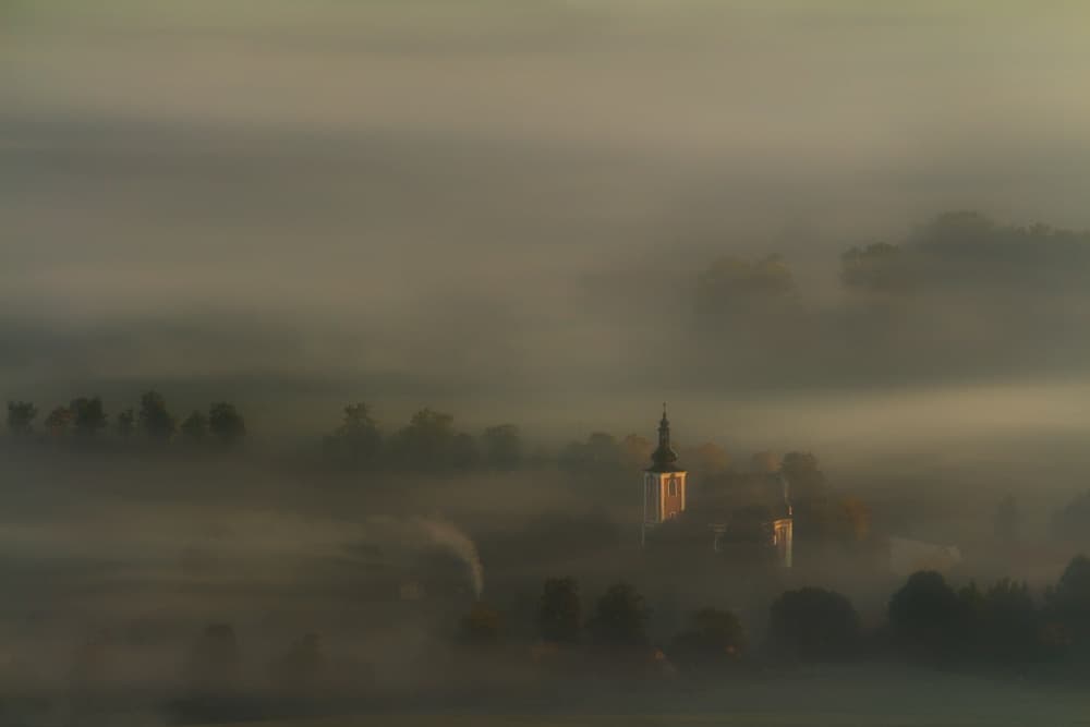 Sunlit Foggy Village by Izabela Laszewska-Mitrega / Darek Mitręga — canvas wall art