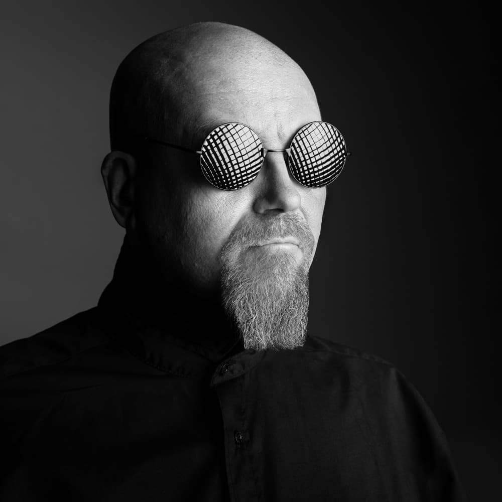 Man In Patterned Glasses by Petri Damstén — canvas wall art