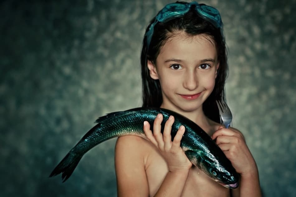 Smiling Girl Fresh Fish by Svetlana Bekyarova — canvas wall art