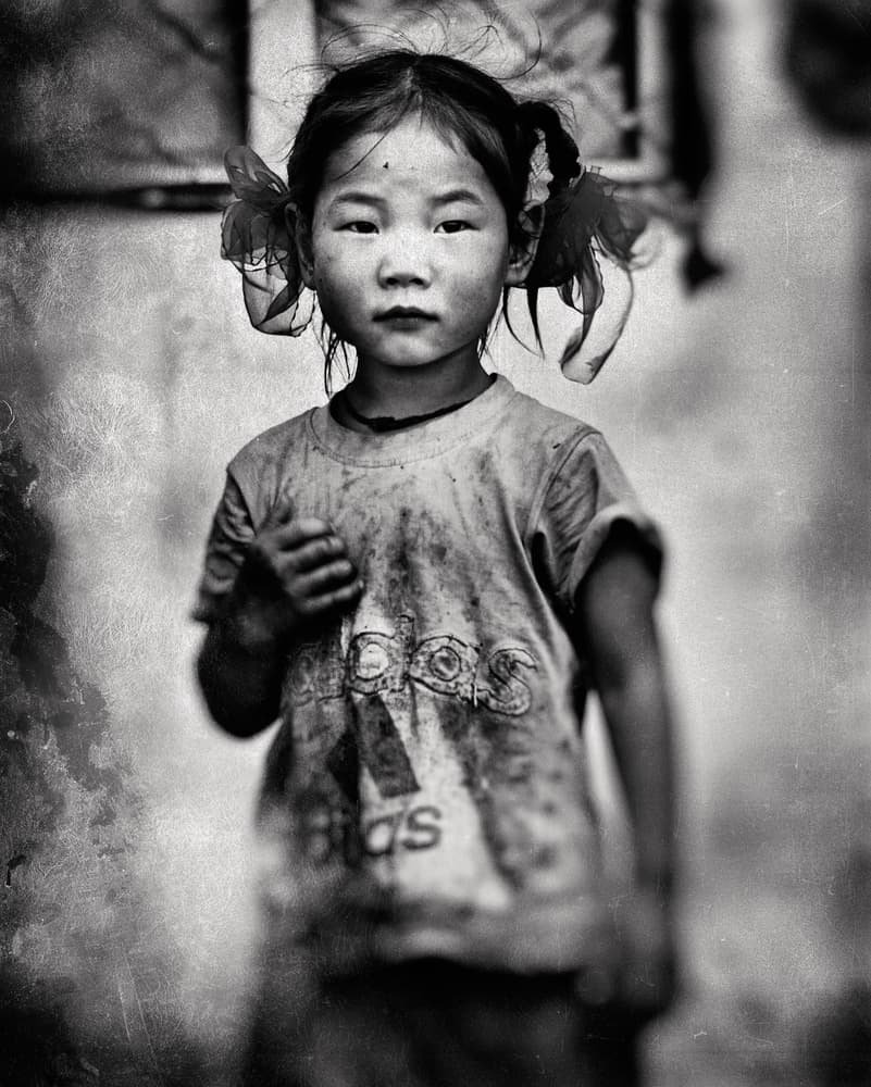 Young Girl Solemn Gaze by txules — canvas wall art