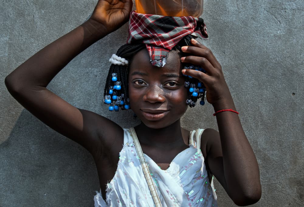Smiling African Girl by Joxe Inazio Kuesta Garmendia — canvas wall art