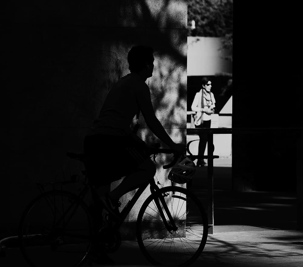 Urban Cyclist Silhouette by Jian Wang — canvas wall art