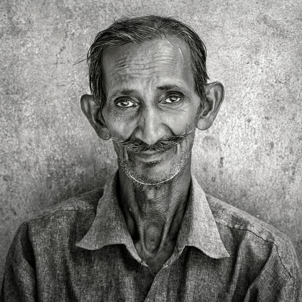 Smiling Man With Mustache by Hugh Wilkinson — canvas wall art