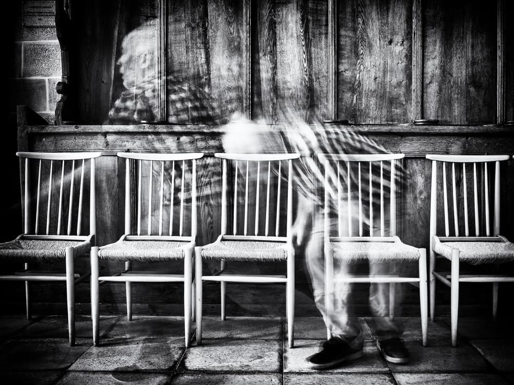 Blurred Figure Empty Chairs by Jürgen Hartlieb — canvas wall art
