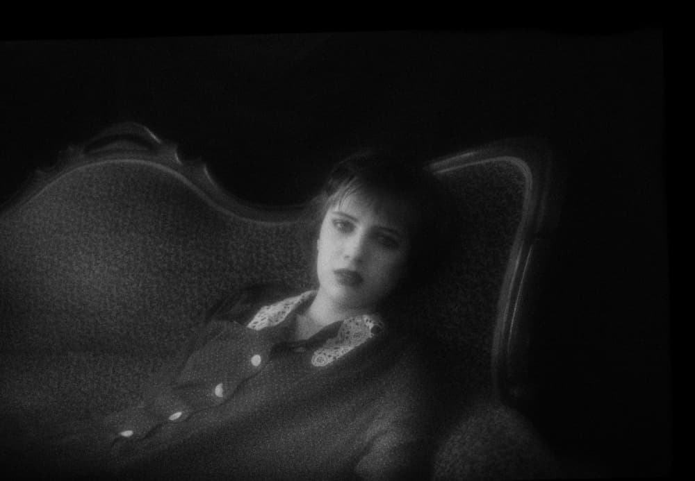 Pensive Woman on Sofa by Angelika Vogel — canvas wall art