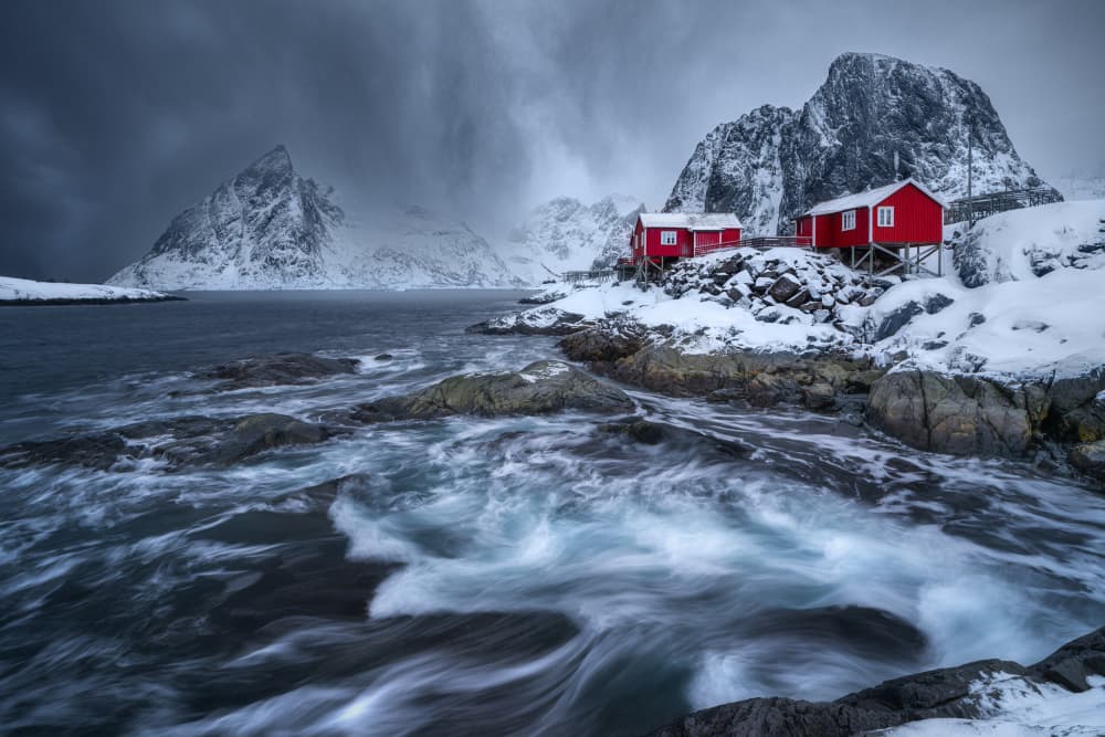 Red Cabins Snowy Coast by Adam Pachula — canvas wall art